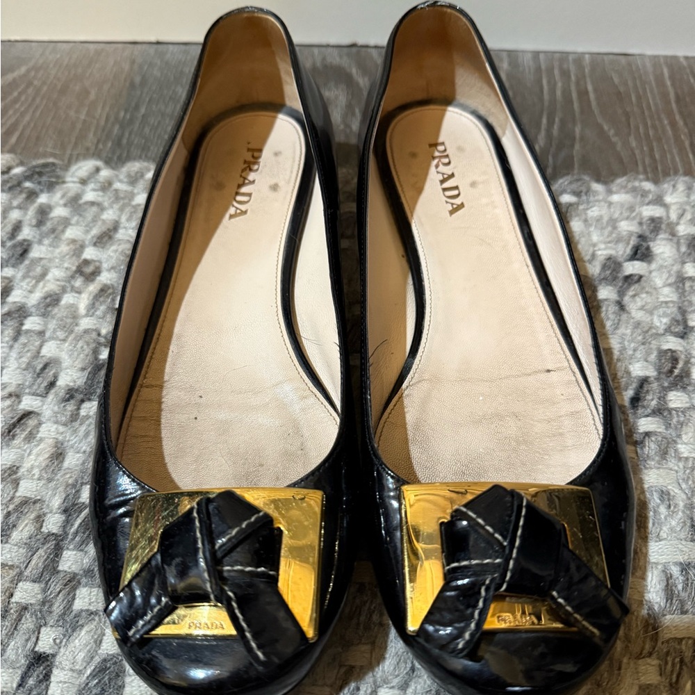 Prada Black Flats with Gold Detailing
